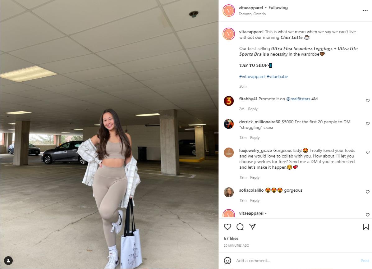 Vitae apparel ambassador posing in a parking garage in matching fitness set
